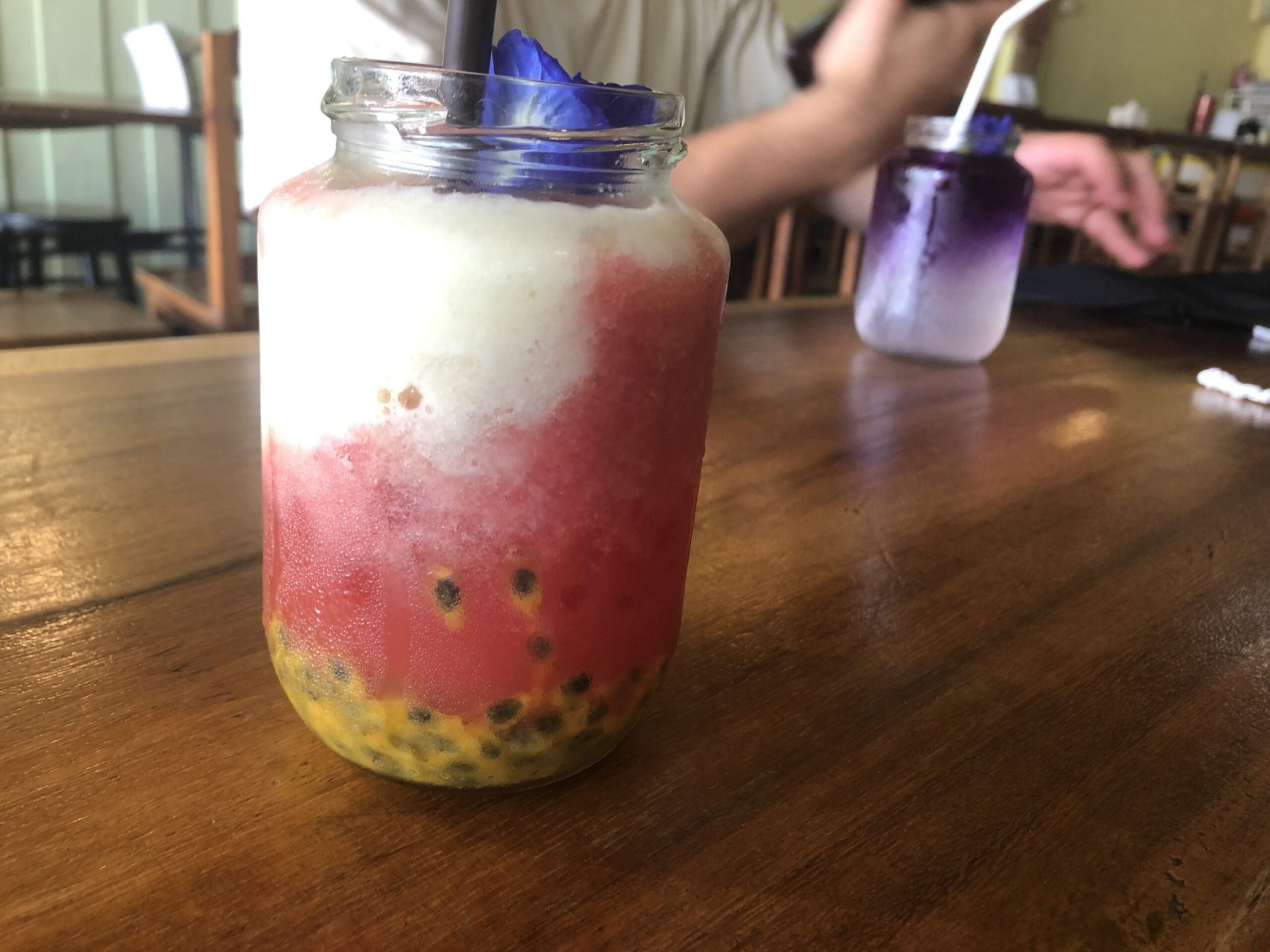 A smoothie with passionfruit and watermelon